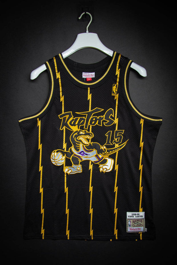 Toronto Raptors Vince Carter Black Gold 1998-99 Hardwood Classics Authentic Jersey Mitchell & Ness Basketball Jersey Toronto Raptors Vince Carter Black Gold 1998-99 Hardwood Classics Authentic Jersey Toronto Raptors Vince Carter Black Gold 1998-99 Hardwood Classics Authentic Jersey - Devious Elements Apparel