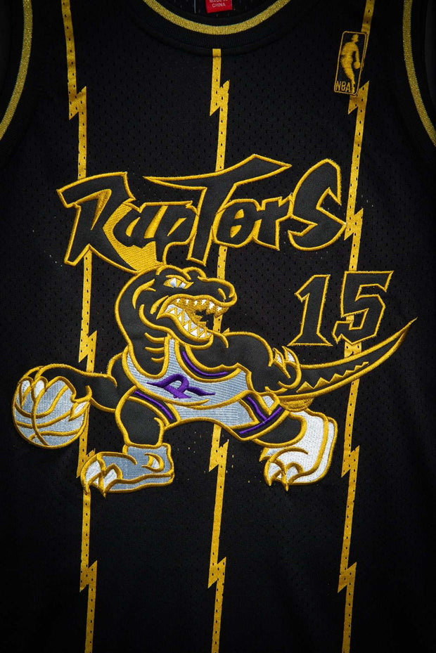 Toronto Raptors Vince Carter Black Gold 1998-99 Hardwood Classics Authentic Jersey Mitchell & Ness Basketball Jersey Toronto Raptors Vince Carter Black Gold 1998-99 Hardwood Classics Authentic Jersey Toronto Raptors Vince Carter Black Gold 1998-99 Hardwood Classics Authentic Jersey - Devious Elements Apparel