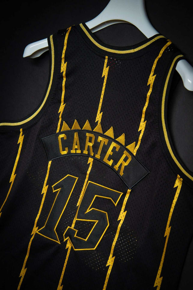 Mitchell & Ness Toronto Raptors Vince Carter Black Gold 1998-99 Hardwood Classics Authentic Jersey by Devious Elements App Small